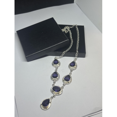 628 - A MARKED 925 SILVER NECKLACE WITH PURPLE STONES IN A PRESENTATION BOX