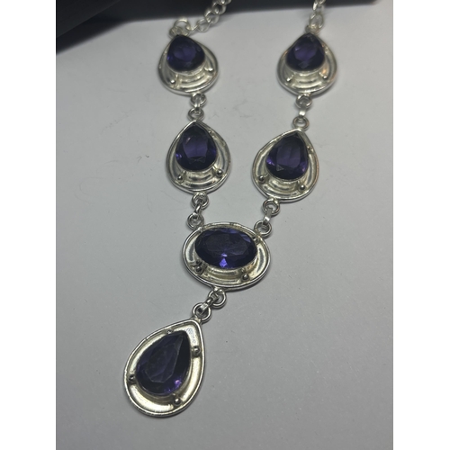 628 - A MARKED 925 SILVER NECKLACE WITH PURPLE STONES IN A PRESENTATION BOX