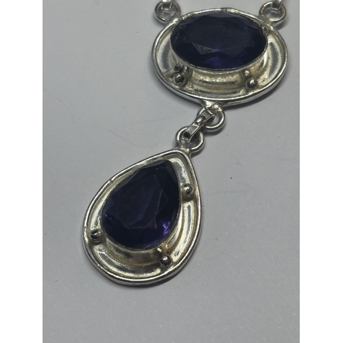 628 - A MARKED 925 SILVER NECKLACE WITH PURPLE STONES IN A PRESENTATION BOX