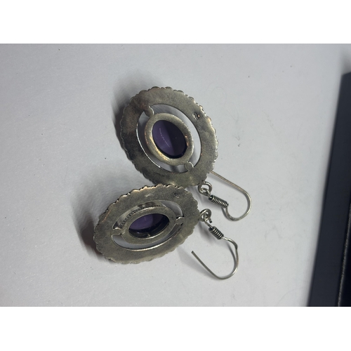 632 - A PAIR OF MARKED 925 SILVER EARRINGS WITH PURPLE STONES IN A PRESENTATION BOX