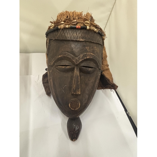 103 - A WOODEN TRIBAL MASK WITH HESSIAN BACK AND TOP