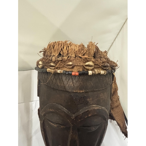 103 - A WOODEN TRIBAL MASK WITH HESSIAN BACK AND TOP