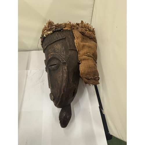 103 - A WOODEN TRIBAL MASK WITH HESSIAN BACK AND TOP