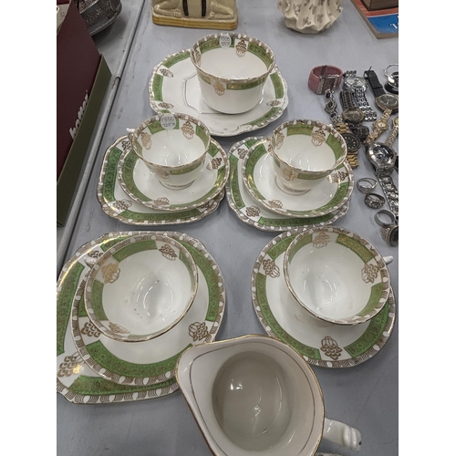 104 - VARIOUS ITEMS OF ST MICHAEL TEAWARE TO INCLUDE TRIOS, CAKE PLATE, SUGAR BOWL, JUG, CUPS AND SAUCERS