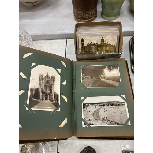 121 - A QUANTITY OF VINTAGE POSTCARDS TOGETHER WITH AN ALBUM CONTAINING POSTCARDS OF PLACES