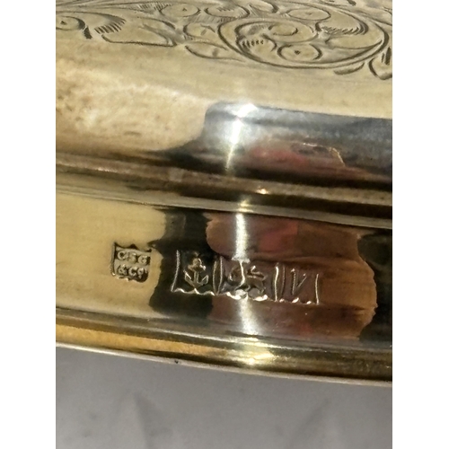 17 - THREE GLASS DRESSING TABLE ITEMS WITH HALLMARKED SILVER TOPS TO INCLUDE TWO POTS AND A SCENT BOTTLER