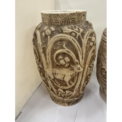 24 - TWO LARGE STONEWARE VASES WITH RELIEF DECORATION OF CHARIOT RACING ON ONE AND ANIMALS ON THE OTHER, ... 