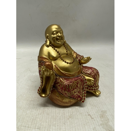 334 - A CHINESE SITTING BUDDHA FIGURE - 12.5 CM