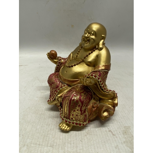 334 - A CHINESE SITTING BUDDHA FIGURE - 12.5 CM