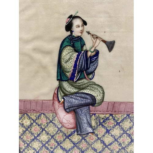 337 - A 19TH CENTURY CHINESE GOUACHE OF A NOBLE WOMAN HOLDING AN INSTRUMENT ON RICE PAPER FRAMED AND GLAZE... 