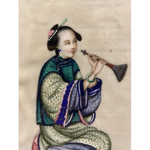 337 - A 19TH CENTURY CHINESE GOUACHE OF A NOBLE WOMAN HOLDING AN INSTRUMENT ON RICE PAPER FRAMED AND GLAZE... 