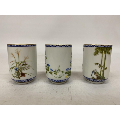 348 - A COLLECTION OF ELEVEN HAND-PAINTED JAPANESE PORCELAIN SAKE/TEA CUPS