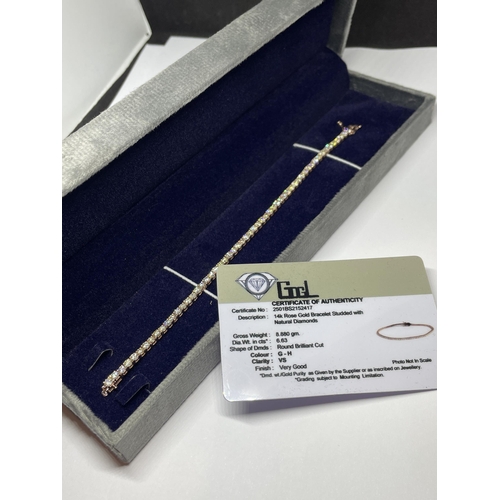 511 - A MARKED 14K ROSE TENNIS BRACELET WITH A GEMOLOGY CARD IN A PRESENTATION BOX