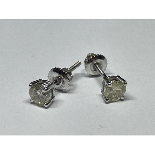 638 - A PAIR OF MARKED 14K SOLITAIRE EARRINGS WITH SCREW ON BUTTERFLY IN A PRESENTATION BOX WITH GEMOLOGY ... 