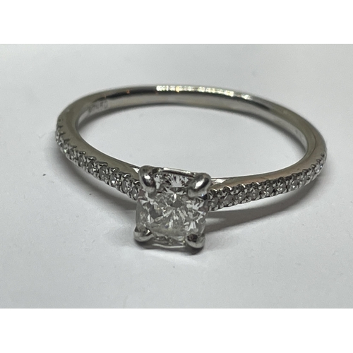 643 - A MARKED PLATINIUM RING WITH AN APPROXIMATELY 0.5 CARAT STONE TESTING TO DIAMOND AND FUETHER TO THE ... 