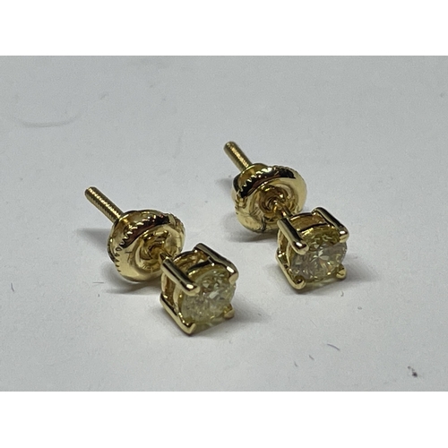 646 - A PAIR OF MARKED 14K SOLITAIRE EARRINGS WITH SCREW ON BUTTERFLY IN A PRESENTATION BOX WITH GEMOLOGY ... 