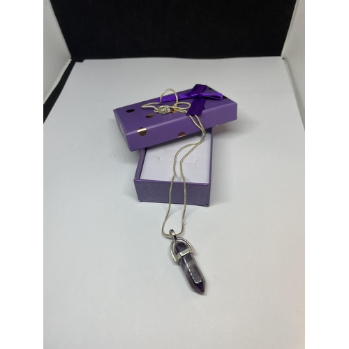 654 - A MARKED SILVER NECKLACE WITH PURPLE STONE PENDANT IN A PRESENTATION BOX