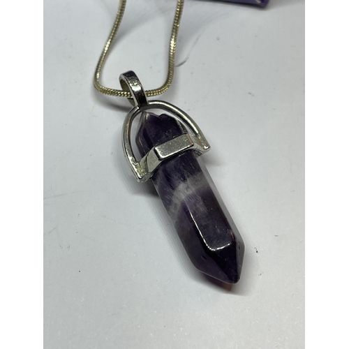 654 - A MARKED SILVER NECKLACE WITH PURPLE STONE PENDANT IN A PRESENTATION BOX