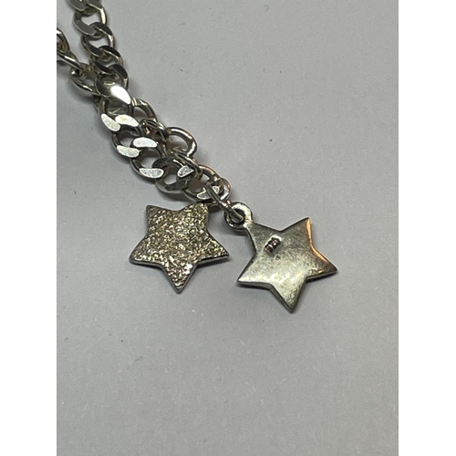 662 - A MARKED SILVER BRACELET WITH DOUBLE HEART, DOUBLE CROSS AND DOUBLE STAR CHARMS