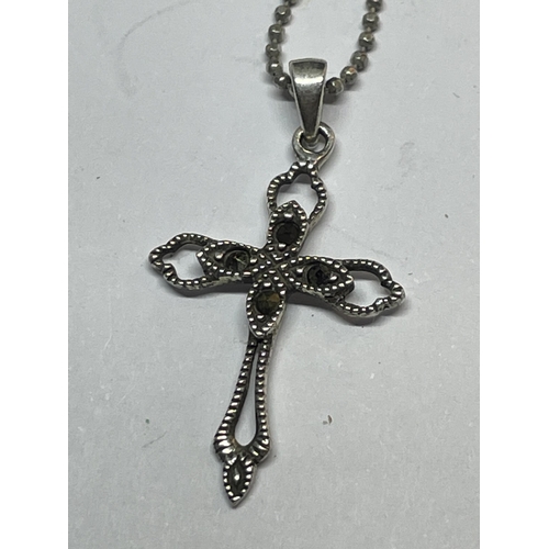 663 - A MARKED SILVER MARCASITE STYLE CROSS PENDANT ON A MARKED SILVER CHAIN