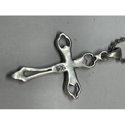 663 - A MARKED SILVER MARCASITE STYLE CROSS PENDANT ON A MARKED SILVER CHAIN