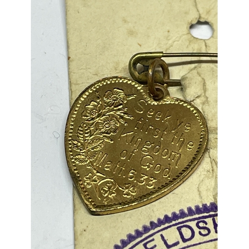 665 - A RELIGIOUS HEART PENDANT ON ORIGINAL CARD DATED 1883-1933 YIELDSHEILDS SUNDAY SCHOOL