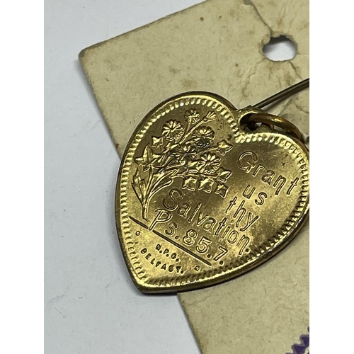 665 - A RELIGIOUS HEART PENDANT ON ORIGINAL CARD DATED 1883-1933 YIELDSHEILDS SUNDAY SCHOOL