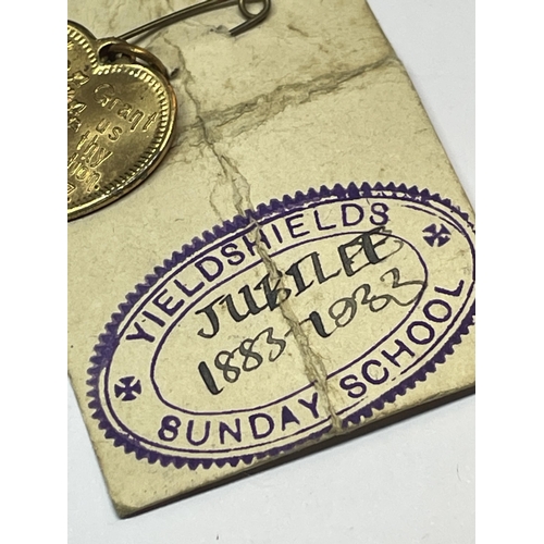 665 - A RELIGIOUS HEART PENDANT ON ORIGINAL CARD DATED 1883-1933 YIELDSHEILDS SUNDAY SCHOOL