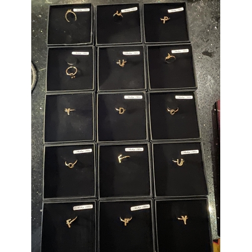 670 - FIFTEEN STERLING SILVER INITAL RINGS IN PRESENTATION BOXES