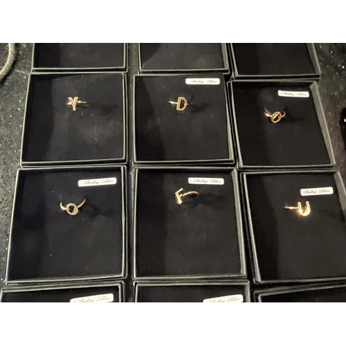 670 - FIFTEEN STERLING SILVER INITAL RINGS IN PRESENTATION BOXES