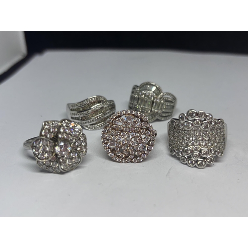 675 - FIVE VARIOUS DRESS RINGS FOUR MARKED SILVER