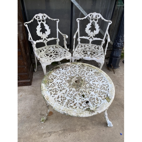 1502 - A VINTAGE CAST ALLOY BISTRO SET COMPRIOSING OF A ROUND COFFEE TABLE AND TWO CARVER CHAIRS