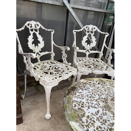 1502 - A VINTAGE CAST ALLOY BISTRO SET COMPRIOSING OF A ROUND COFFEE TABLE AND TWO CARVER CHAIRS