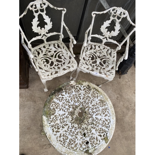 1502 - A VINTAGE CAST ALLOY BISTRO SET COMPRIOSING OF A ROUND COFFEE TABLE AND TWO CARVER CHAIRS