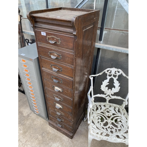 1503 - A VINTAGE TEN DRAWER OAK FILING CHEST WITH SCOOP HANDLES