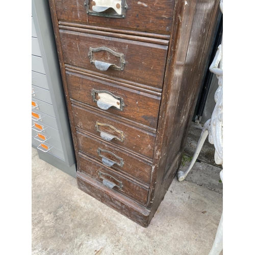 1503 - A VINTAGE TEN DRAWER OAK FILING CHEST WITH SCOOP HANDLES