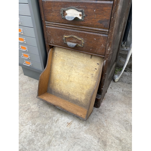 1503 - A VINTAGE TEN DRAWER OAK FILING CHEST WITH SCOOP HANDLES