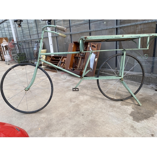 1506 - A VINTAGE STYLKE METAL SHOP DISPLAY BIKE WITH FOLDING BENCH SIDES AND A STORAGE SECTION