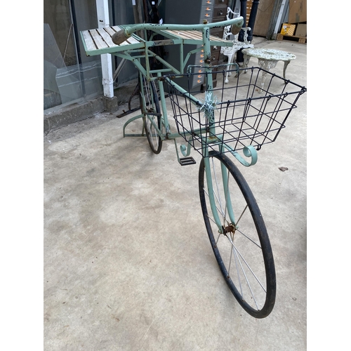 1506 - A VINTAGE STYLKE METAL SHOP DISPLAY BIKE WITH FOLDING BENCH SIDES AND A STORAGE SECTION