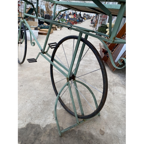 1506 - A VINTAGE STYLKE METAL SHOP DISPLAY BIKE WITH FOLDING BENCH SIDES AND A STORAGE SECTION