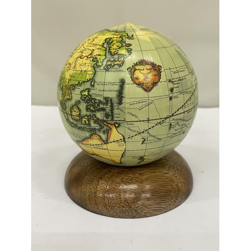 205 - A SMALL WORLD GLOBE ON A WOODEN BASE, HEIGHT 12CM