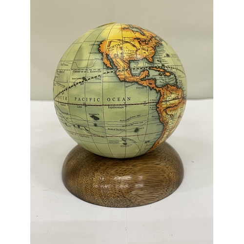 205 - A SMALL WORLD GLOBE ON A WOODEN BASE, HEIGHT 12CM