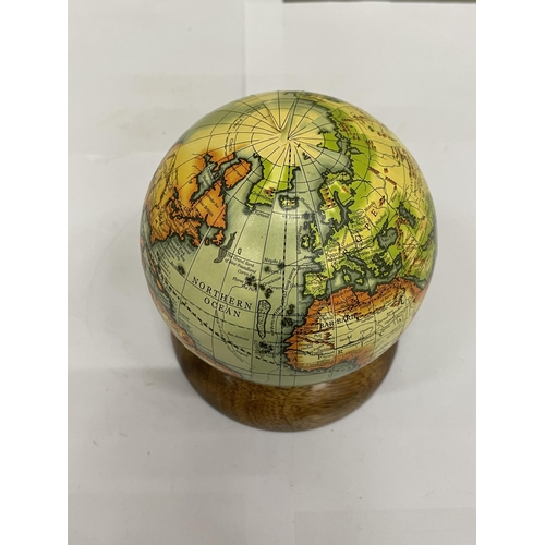 205 - A SMALL WORLD GLOBE ON A WOODEN BASE, HEIGHT 12CM