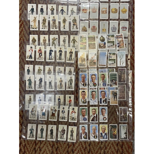 229 - A COLLECTION OF VINTAGE CIGARETTE CARDS IN SLEEVES