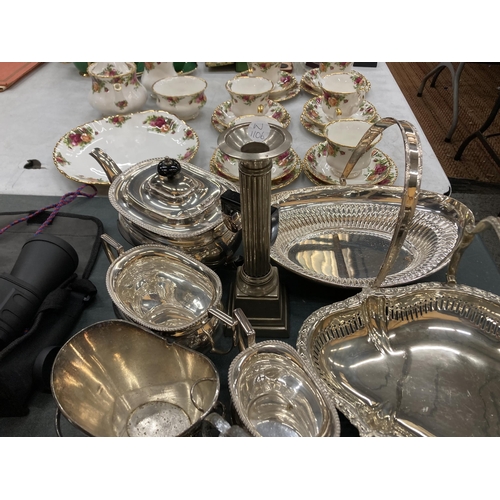 267 - A COLLECTIION OF SILVER PLATE TO INCLUDE BUTTER DISH, TEAPOT, CANDLESTICK, SERVING PLATES, ETC.,