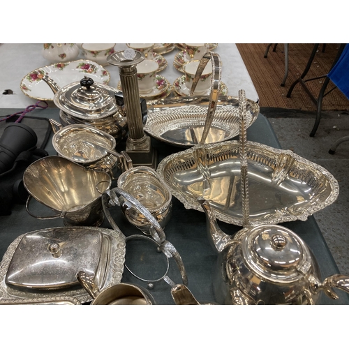 267 - A COLLECTIION OF SILVER PLATE TO INCLUDE BUTTER DISH, TEAPOT, CANDLESTICK, SERVING PLATES, ETC.,