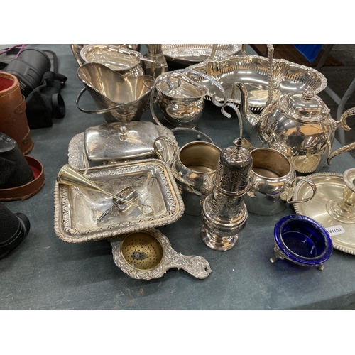 267 - A COLLECTIION OF SILVER PLATE TO INCLUDE BUTTER DISH, TEAPOT, CANDLESTICK, SERVING PLATES, ETC.,