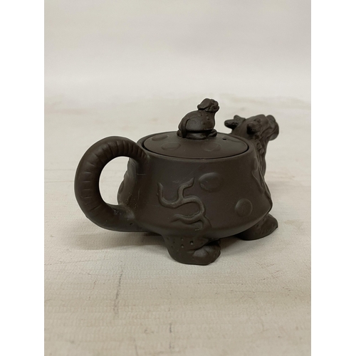 359 - A CHINESE YIXING DRAGON AND TURTLE CLAY TEAPOT