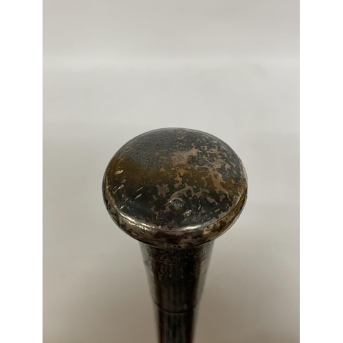 36 - A VINTAGE WALKING CANE WITH A WHITE METAL TOP