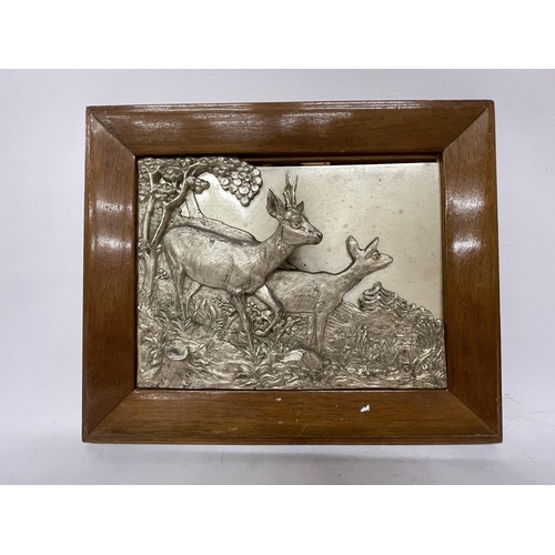 47 - TWO SILVER PLATED FRAMED DEER IN 3D RELIEF, SIGNED TO THE REAR